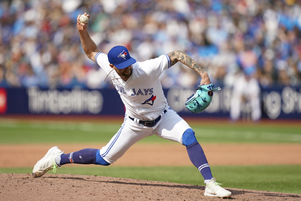 Toronto Blue Jays relief pitcher Adam Cimber (90) throws against the Minnesota Twins during the eighth inning of a baseball game, Saturday, June 10, 2023, in Toronto. (Arlyn McAdorey/The Canadian Press via AP)