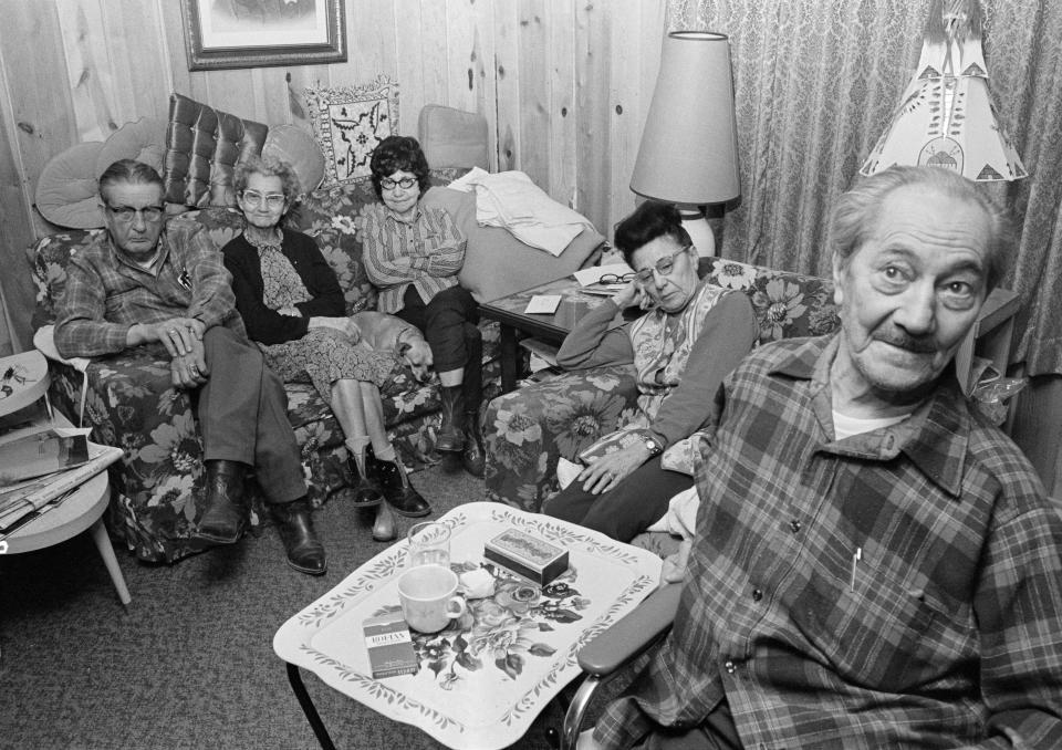 FILE - Some of the hostages held by the American Indian Movement, from left, Clive Gildersleeve, Mary Pike, Agnes Gildersleeve, A.M. Clark, and William Riegert, gather together in Wounded Knee, S.D., on March 2, 1973, after they were released. They had been held since Tuesday, Feb. 27. (AP Photo/Jim Mone, Pool, File)