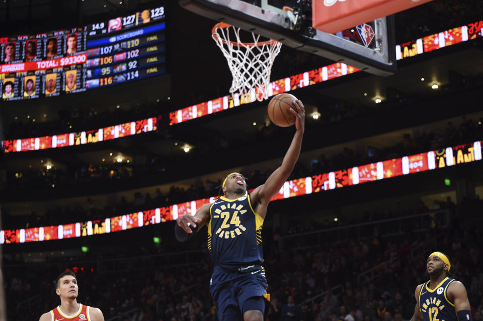 Indiana Pacers guard Buddy Hield (24) scores during the second half of an NBA basketball game against the Atlanta Hawks, Sunday, March 13, 2022, in Atlanta. (AP Photo/Hakim Wright Sr.)