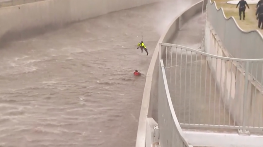 Firefighters rescue woman from storm-flooded L.A. River