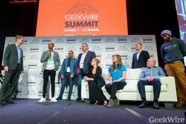 GeekWire’s John Cook, left, speaks with the Elevator Pitch finalists on stage at the GeekWire Summit in October. Jonathan Kumar, right, CEO of Samaritan, accepted the grand prize for his app to aid the homeless. (GeekWire Photo / Dan DeLong) <a href="https://www.geekwire.com/2018/elevator-pitch-finalists-take-stage-geekwire-summit-champion-rises-top/" rel="nofollow noopener" target="_blank" data-ylk="slk:Read the story.;elm:context_link;itc:0;sec:content-canvas" class="link "><strong>Read the story.</strong></a>