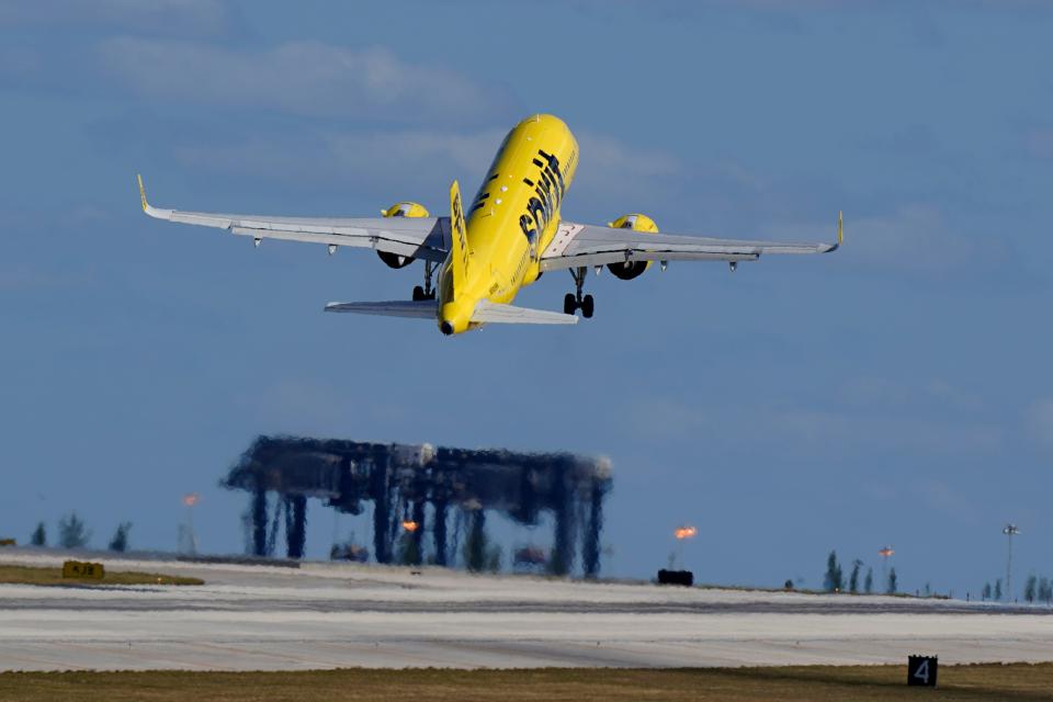 A Spirit Airlines Airbus A320 takes off from Fort Lauderdale-Hollywood International Airport, Tuesday, Jan. 19, 2021, in Fort Lauderdale, Florida. (AP Photo/Wilfredo Lee)