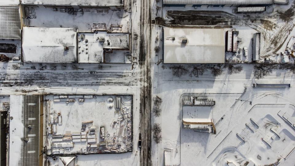 Snow-covered buildings are seen in Louisville, Kentucky, under freezing temperatures on December 23, 2022 (AFP via Getty Images)