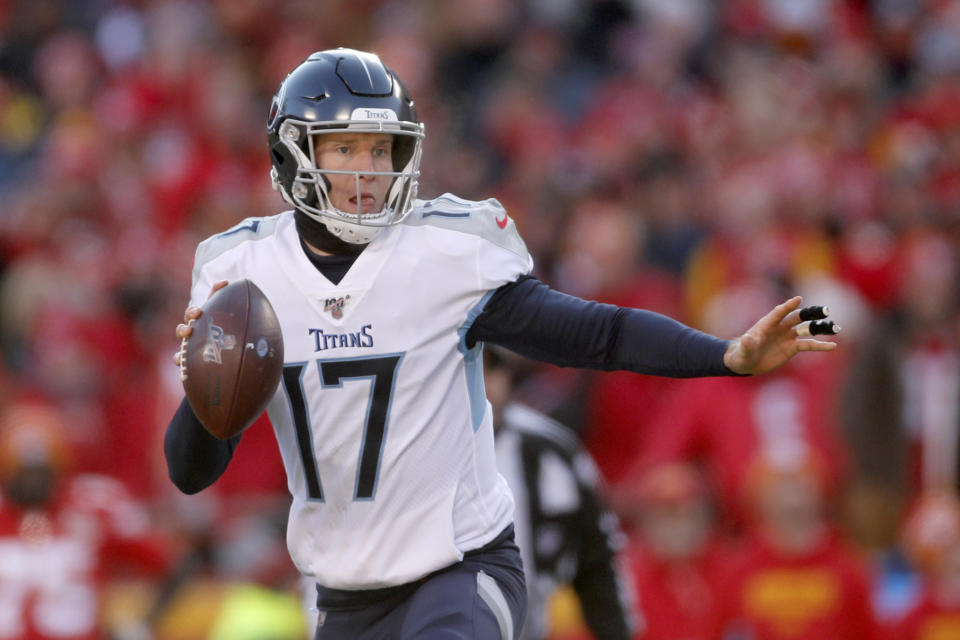 Tennessee Titans' Ryan Tannehill scrambles during the first half of the NFL AFC Championship football game against the Kansas City Chiefs Sunday, Jan. 19, 2020, in Kansas City, MO. (AP Photo/Jeff Roberson)