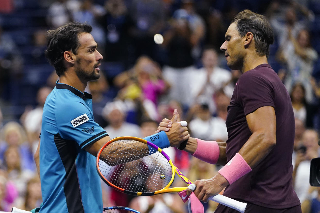 Rafael Nadal, right, of Spain, shakes hands with Fabio Fognini, of Italy, after defeating him during the second round of the U.S. Open tennis championships, Friday, Sept. 2, 2022, in New York. (AP Photo/Frank Franklin II)