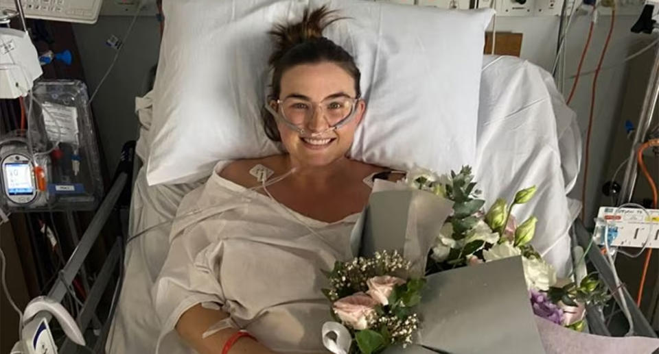 Kirsty Bryant lies in a hospital bed after having a successful uterus transplant.