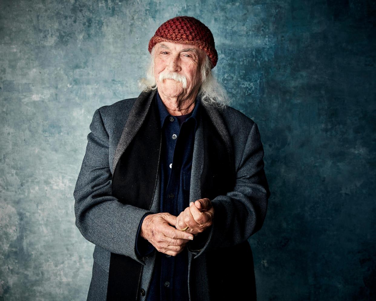 Musician David Crosby has died at age 81, according to various sources. He was a founding member of the bands the Byrds and Crosby, Stills & Nash that helped usher in the folk - rock genre in the 1960s. Crosby's vocal harmonies also graced the recordings of Joni Mitchell, Jackson Browne, James Taylor, Carole King, Phil Collins and Elton John among many others. Here Crosby poses for a portrait to promote the documentary film "David Crosby: Remember My Name" at the Salesforce Music Lodge during the Sundance Film Festival in Park City, Utah. Crosby offers candid reflections on his career, relationships and feuds with others in the new film.