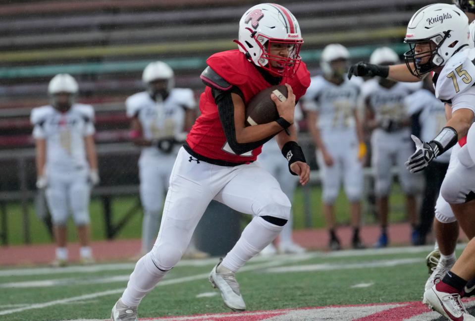 Alexander Vargas is shown as he runs the ball for the Cutters, against Bergen Tech. Vargas was able to run through the Knights defense for a touchdown in the first quarter, Thursday, September 28, 2023.