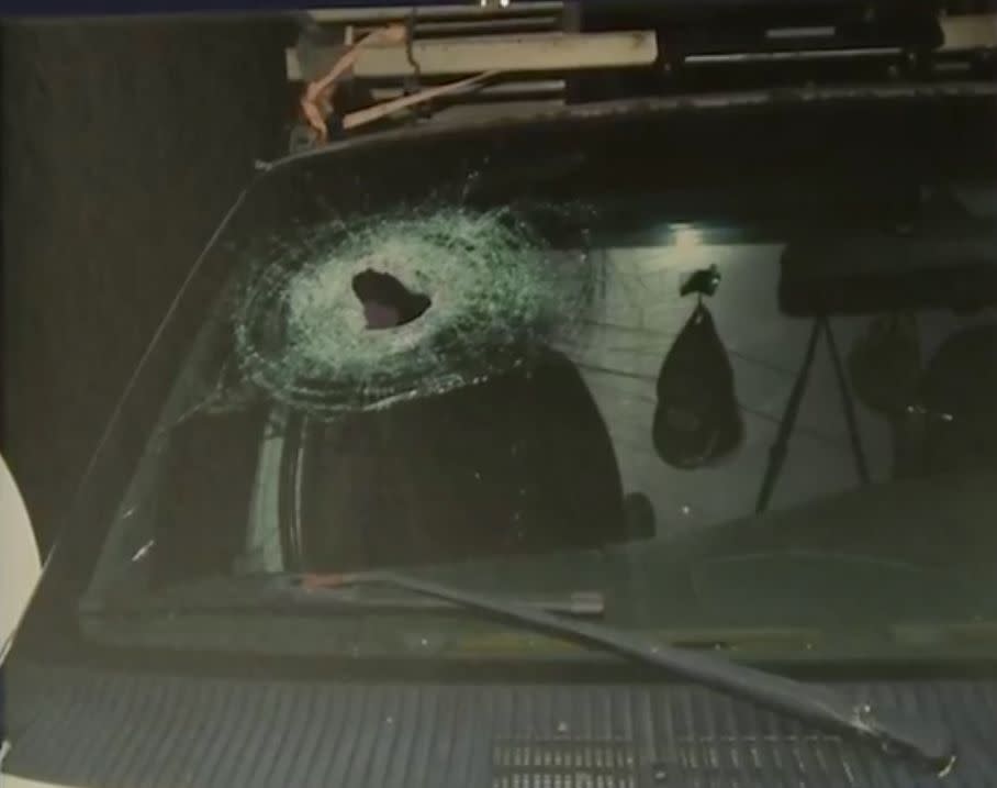 This photo shows a hole left in the windshield of a car that&nbsp;Kenneth Andrew White had been riding in at the time of his fatal injury. (Photo: Genesee County Prosecutors Office)