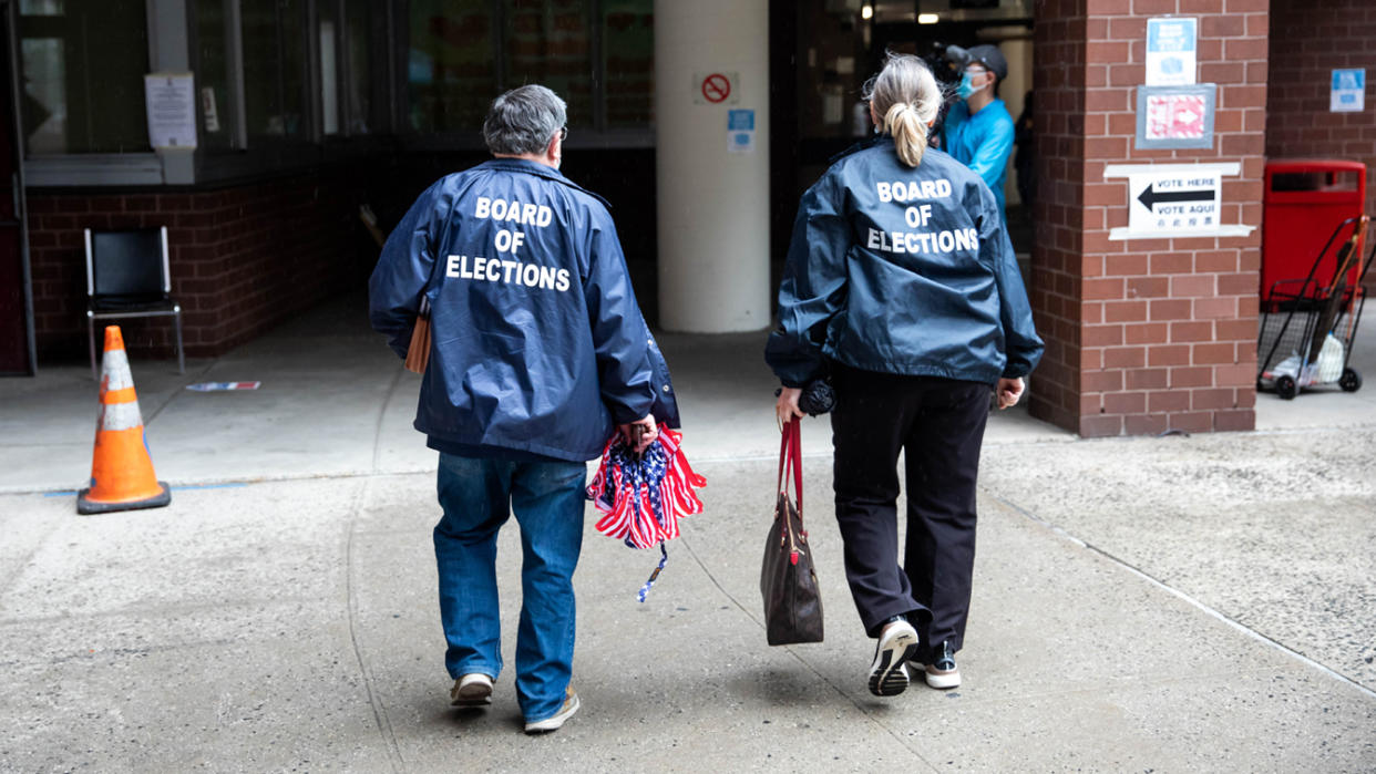 Board of Elections workers arrive at a polling site in Chinatown, Manhattan, for the New York City mayoral primary election on June 22, 2021. 