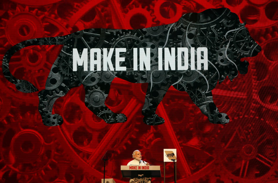 FILE - In this Feb. 13, 2016 file photo, Indian Prime Minister Narendra Modi speaks during the inaugural ceremony of 'Make in India' week, an initiative launched to encourage international companies to manufacture their goods in India, in Mumbai, India. Indian Prime Minister Narendra Modi's party claimed it had won re-election with a commanding lead in vote count Thursday, May 23, 2019. Modi, 68, the leader of the Hindu nationalist Bharatiya Janata Party, has carefully constructed an image of himself as a pious man of the people, a would-be monk called to politics who has elevated India’s status globally and transformed its parliamentary elections from a contest of political parties on social and economic issues into a cult of personality. (AP Photo/Rajanish Kakade, File)