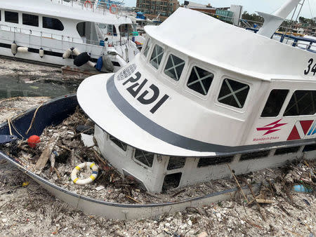 A boat is seen surrounded by trash at Sai Kung, Hong Kong, China, September 17, 2018 in this image obtained from from social media. SHIRLEY NG TERRELL/via REUTERS