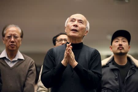 Participants pray for Canadian pastor Hyeon Soo Lim who is being held in North Korea during a joint multi-cultural prayer meeting at Light Korean Presbyterian Church in Toronto, December 20, 2015. REUTERS/Hyungwon Kang