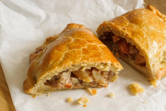 a cornish pasty broken in half to reveal the filling