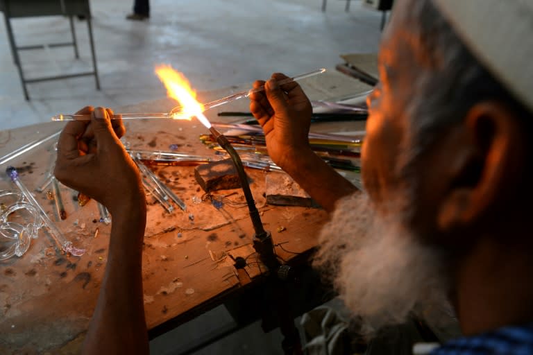 An Indian artisan attends a government-run training workshop to learn new techniques in glass art at Firozabad