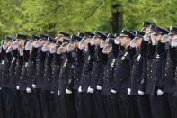 Police officers line the street as the funeral procession of New York police officer Anastasios Tsakos leaves the St. Paraskevi Greek Orthodox Shrine Church, Tuesday, May 4, 2021, in Greenlawn, N.Y. Tsakos was at the scene of an accident on the Long Island Expressway when he was struck and killed by an allegedly drunk driver a week ago. (AP Photo/Mark Lennihan)