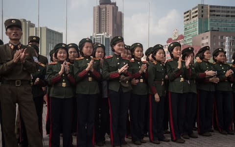 As North Korean dictator Kim Jong-un boasts of his military prowess and flaunts his high tech weapons to the world, his malnourished soldiers are said to be stealing corn from fields to stave off hunger pangs. Officers are ordering their troops to supplement their meagre food rations by plundering local fields, in order to keep up their strength for battle, according to a report in the Daily NK. “The military officers are instructing their soldiers, exhausted after training, to eat corn in the fields because war is imminent,” a source in North Hamgyong Province told the news website. Inside North Korea “They are even threatening their soldiers, saying: if you become malnourished despite permission to eat the corn, you will face difficulties.” Another source in Ryanggang Province claimed that soldiers carrying big sacks of unripened corn had frequently been spotted trying to sell their wares at markets. The desperate conditions of his army paints a stark contrast with Mr Kim’s brash threats since he fired a ballistic missile over Japan on Tuesday. North Korean leader Kim Jong-un presides over a target strike exercise conducted by the special operation forces of the Korean People's Army Credit: AFP On Wednesday he hailed the test as a “good experience in…rocket operation for an actual war” and as a “meaningful prelude to containing” Guam, the US Pacific territory he threatened with missile strikes earlier this month. North Korean citizens, some of whom now have to guard their fields from marauding troops, are reported to be unimpressed by his bravado. “An increasing number of residents are pointing out that, for them, provoking the US is a losing battle,” the Daily NK reported. Korean People's Army (KPA) soldiers applaud as they watch a screen showing the missile test launch, in Pyongyang Credit: AFP 