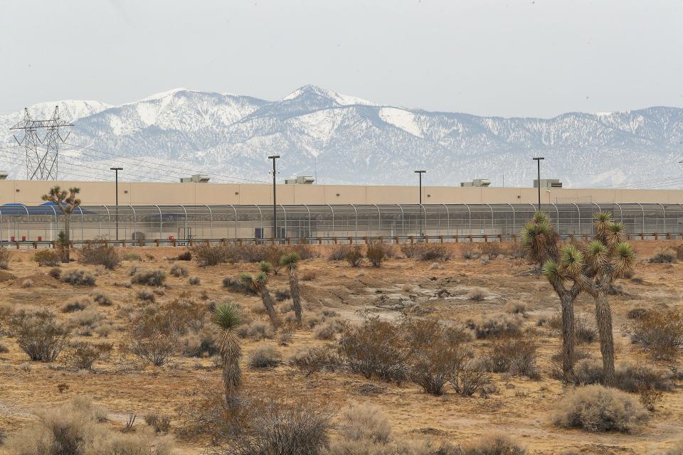 The U.S. Immigration and Customs Enforcement's (ICE) Adelanto Processing Center sits surrounded by Joshua Trees and open desert in Adelanto, Calif.