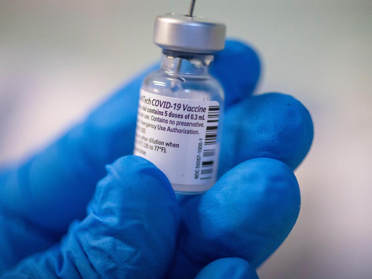 A medical staff member prepares a Pfizer-BioNTech Covid-19 vaccine (AP)