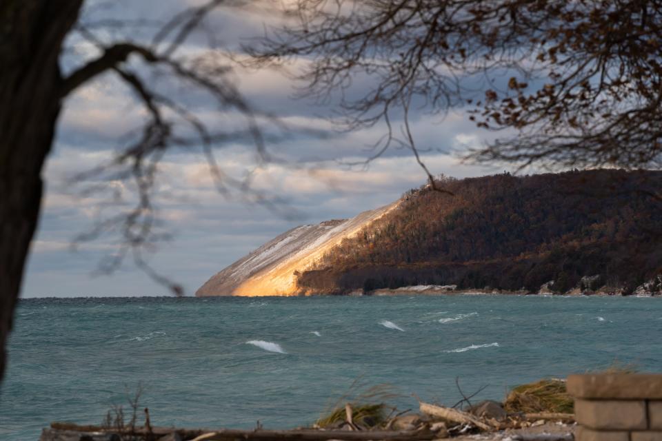 A ray of sunlight breaks through the clouds along an area of the Sleeping Bear Sand Dunes along Lake Michigan in Empire on Wednesday, Nov. 8, 2019.