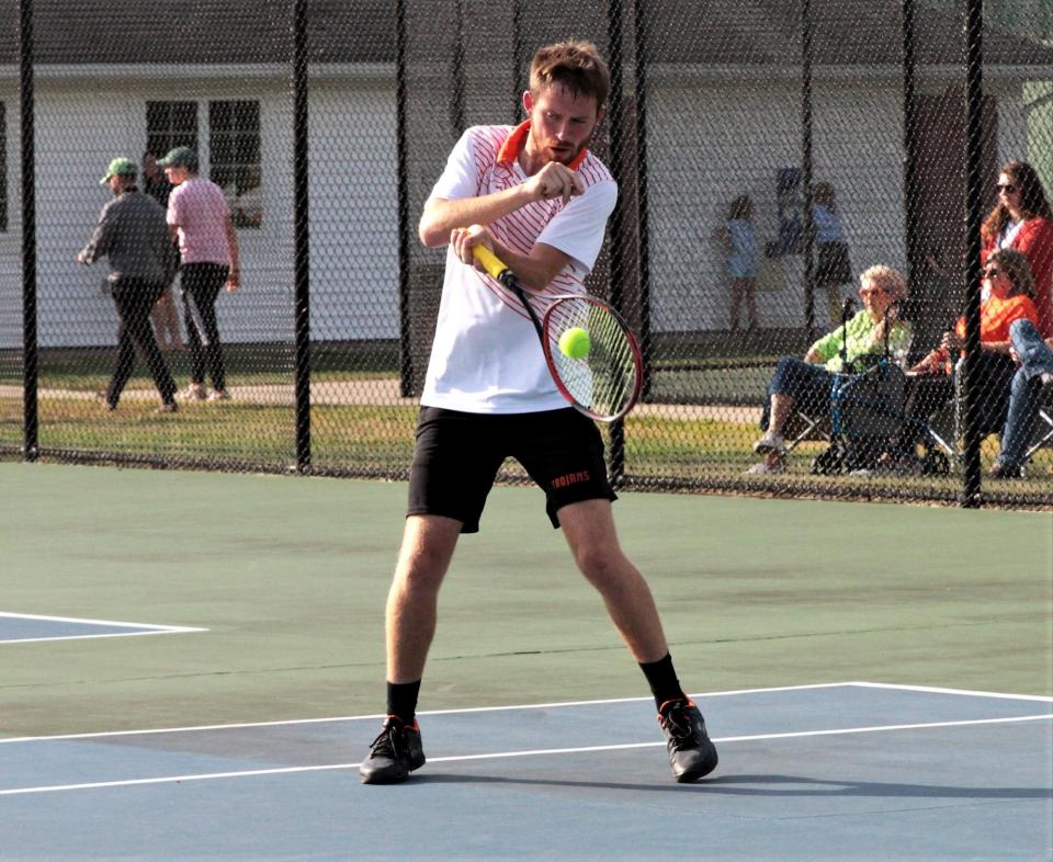 Preston Gump times up a return shot off a serve in his match on Wednesday.