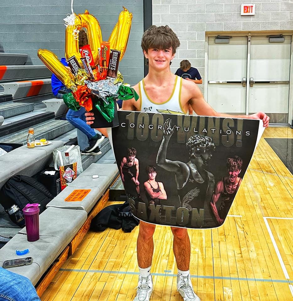 Woodward-Granger's Alex Saxton poses for a photo after   earning his 100th career win on Saturday, Feb. 4, 2023.