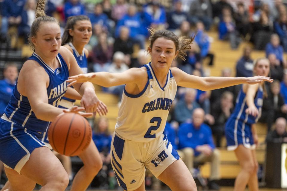 Franklin Community High School junior Erica Buening (15) steals the ball away from Columbus North High School junior Kathryn Wilson (2) during the first half of an IHSAA Girlsâ€™ Sectional basketball game, Tuesday, Jan. 31, 2023, at Shelbyville High School.