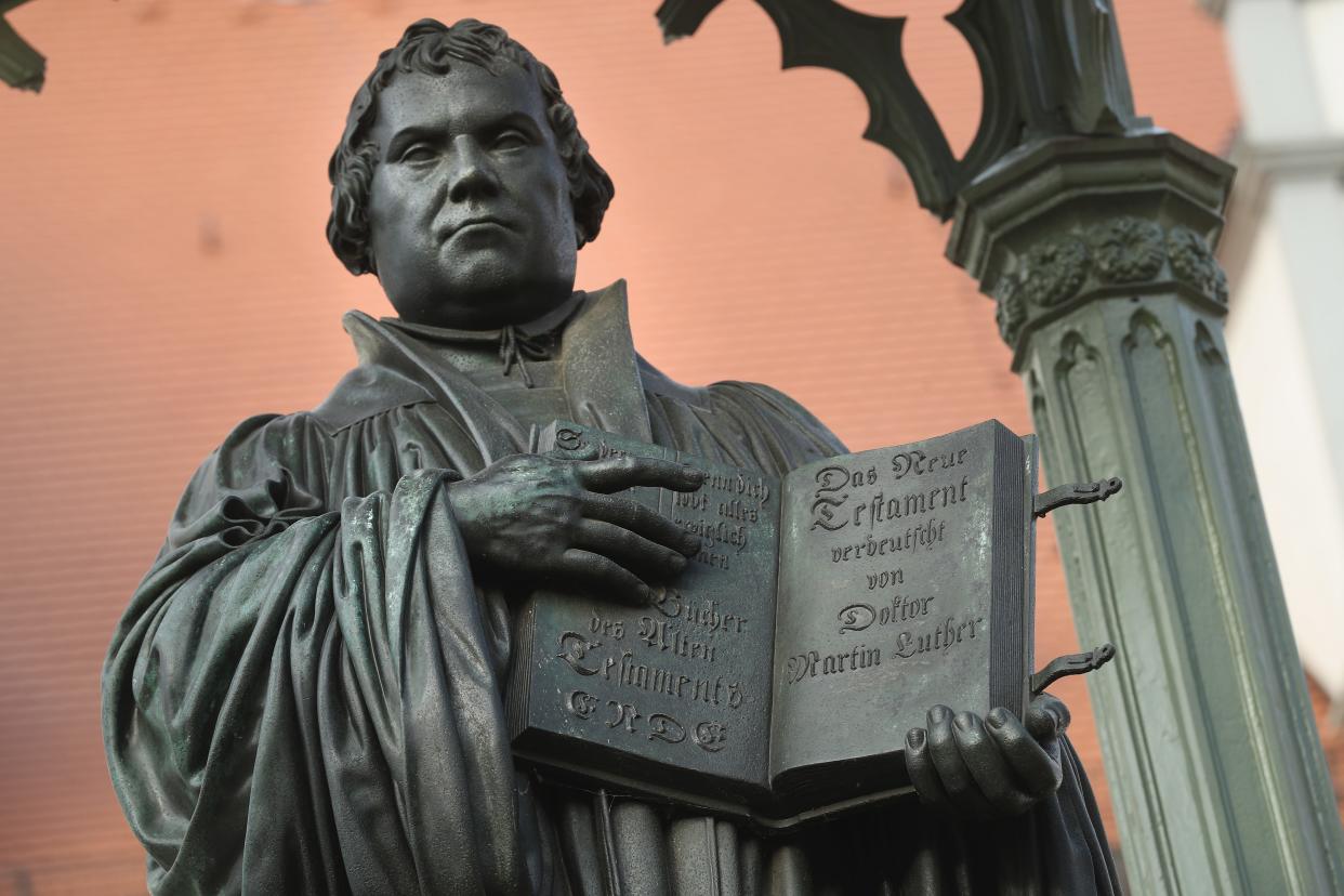 A statue of 16th-century theologian Martin Luther stands on Marktplatz square in Wittenberg, Germany.