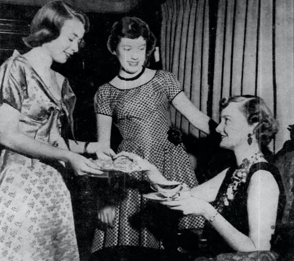 Joan Didion, left, serves tea to recently engaged Carol Emigh, right, at the Didion home in 1954.