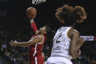 Texas Tech guard Andrayah Adams, left, shoots over Baylor guard DiDi Richards, right, in the first half of an NCAA college basketball game, Saturday, Jan. 25, 2020, in Waco Texas. (AP Photo/Rod Aydelotte)