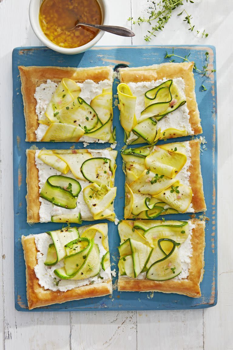 <p>A creamy spread makes this tart irresistible. It's made from a mix of ricotta and goat cheese.</p><p><strong><a href="https://www.countryliving.com/food-drinks/a28610238/marinated-squash-tart-recipe/" rel="nofollow noopener" target="_blank" data-ylk="slk:Get the recipe;elm:context_link;itc:0;sec:content-canvas" class="link ">Get the recipe</a>.</strong> </p>