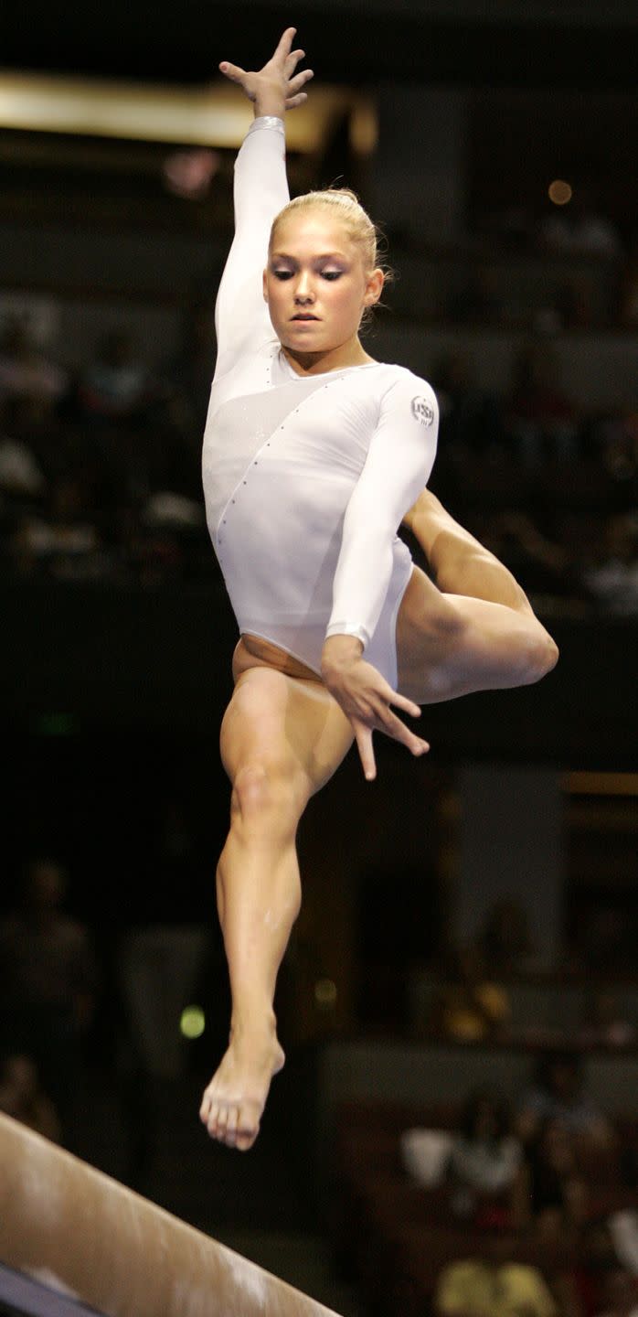 courtney mccool competes on the balance beam during the 2004 us gymnastics olympic trials at the ana