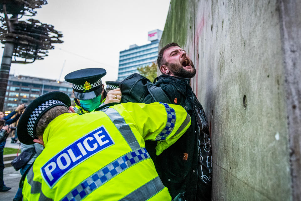  Police officers arrest a protester during the demonstration.
Protests all across the country have been seen this weekend challenging the latest lockdown that was imposed on the country earlier in the week. (Photo by Kenny Brown / SOPA Images/Sipa USA) 