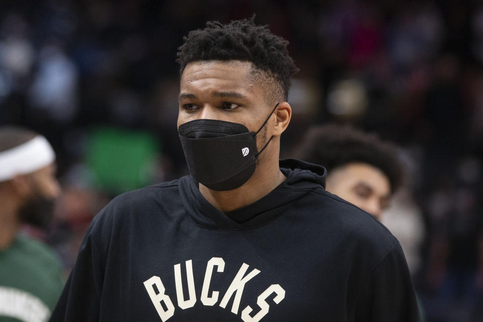 Milwaukee Bucks' Giannis Antetokounmpo leaves the court after sitting out the game in the team's loss to the Toronto Raptors in an NBA basketball game Thursday, Dec. 2, 2021, in Toronto. (Chris Young/The Canadian Press via AP)