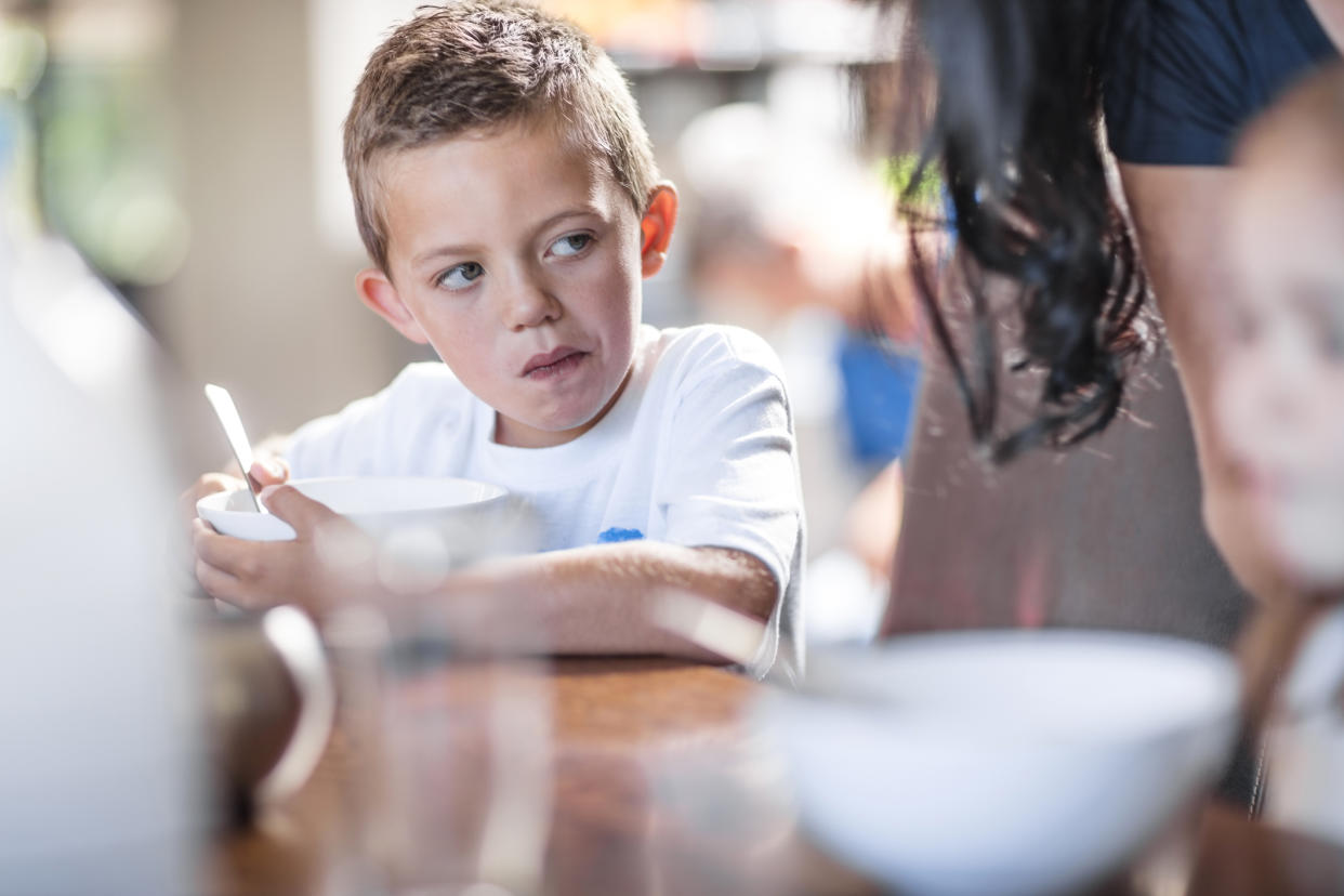 Young boy feeling hungry. (Getty Images)