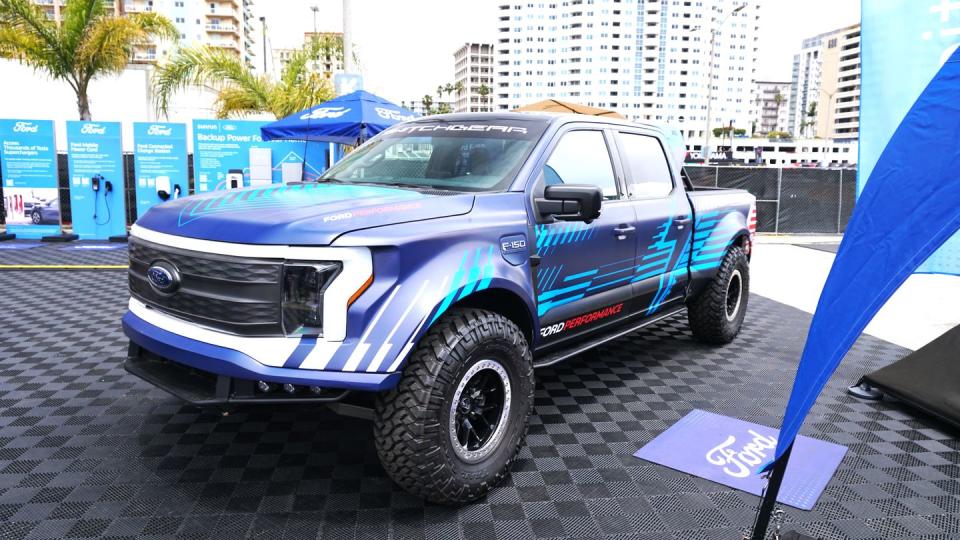 a blue truck parked on a street