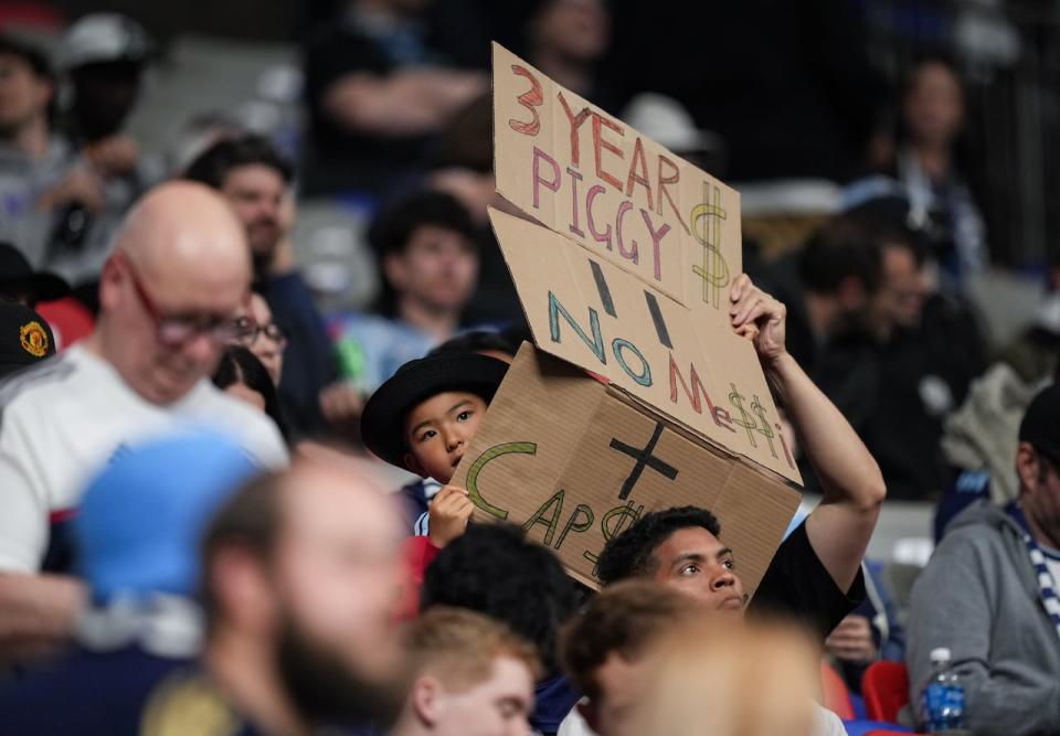 A young fan holds a sign about Lionel Messi before the Vancouver Whitecaps and Inter Miami play an MLS soccer match, in Vancouver, on Saturday, May 25, 2024. Miami head coach Tata Martino told reporters Friday that the club opted to keep the 36-year-old World Cup-winning superstar - as well as Uruguayan striker Luis Suarez and Spanish midfielder Sergio Busquets - in Florida because of a busy upcoming schedule that will see the team play at home on Wednesday and Saturday of next week.