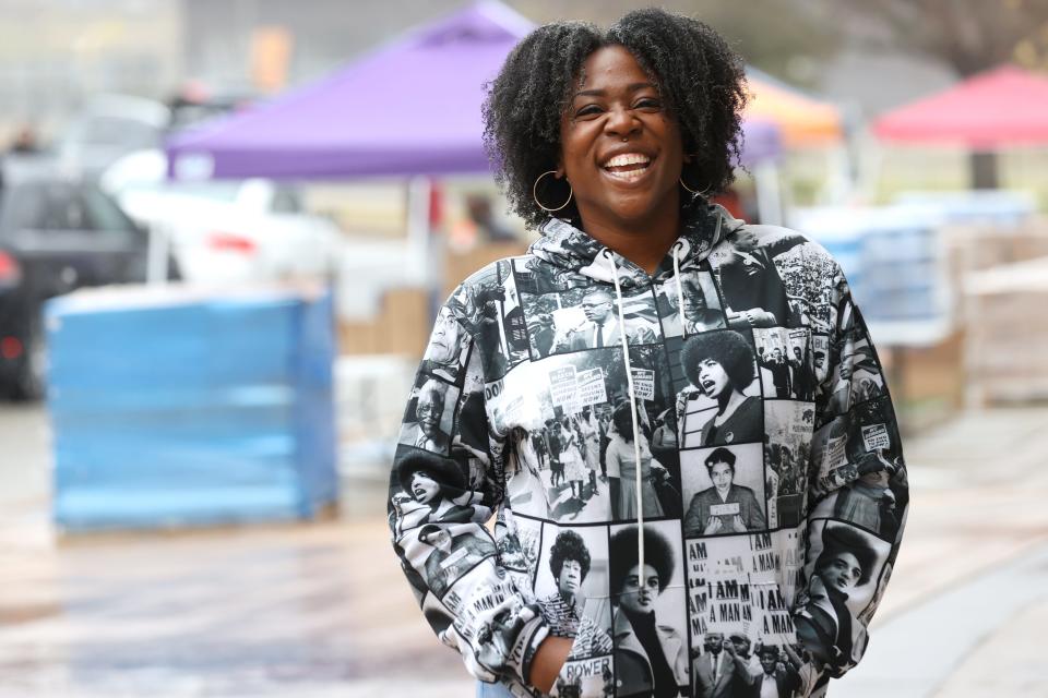 Nakevia Miller stands outside of the Millennium Entertainment Center food distribution site in East Austin on Thursday, where she and her team have been working for the last week to dispense food, water and hygiene products to people in need. &#x00201c;Mostly right now I feel proud. What happened in this moment, is an example of what Community Resilience Trust stands for; we are about helping elevate these grassroots efforts,&quot; said Miller. 