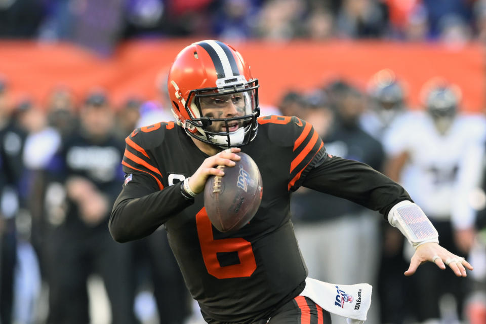 FILE - In this Dec. 22, 2019, file photo, Cleveland Browns quarterback Baker Mayfield scrambles during the second half of an NFL football game against the Baltimore Ravens in Cleveland. Looking back, Browns rookie coach Kevin Stefanski is now thrilled he decided to take a trip to Texas in March to visit Baker Mayfield. During a Zoom conference call on Friday, Aug. 7, 2020, Stefanski revealed that he went to Austin and spent time with Mayfield. (AP Photo/David Richard, File)