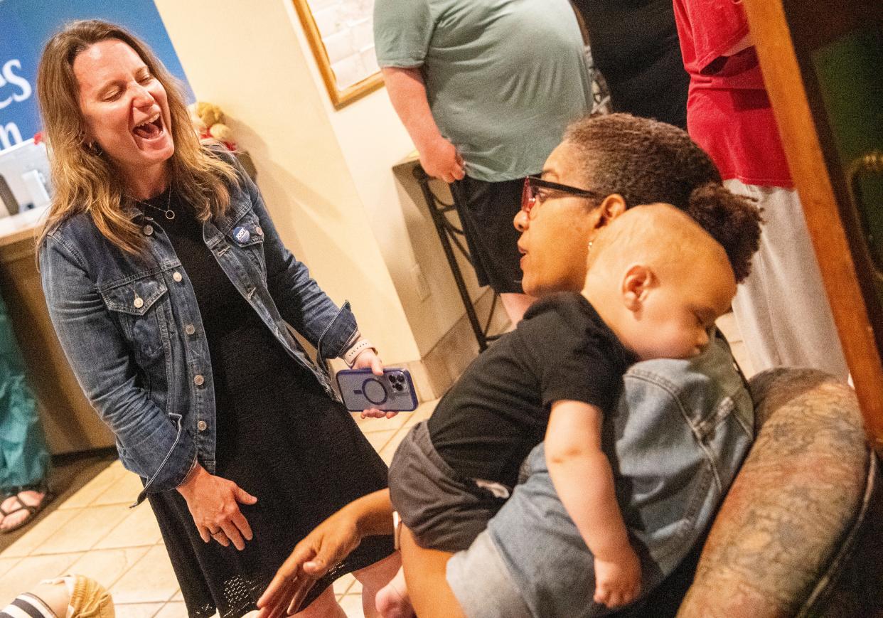 Jody Madeira, who won the Democratic Party primary election for Monroe County Commissioner District 3, laughs while speaking to Bloomington City Clerk Nicole Bolden during the Democratic Party election night celebration at Cascades Inn on Tuesday, May 7, 2024.