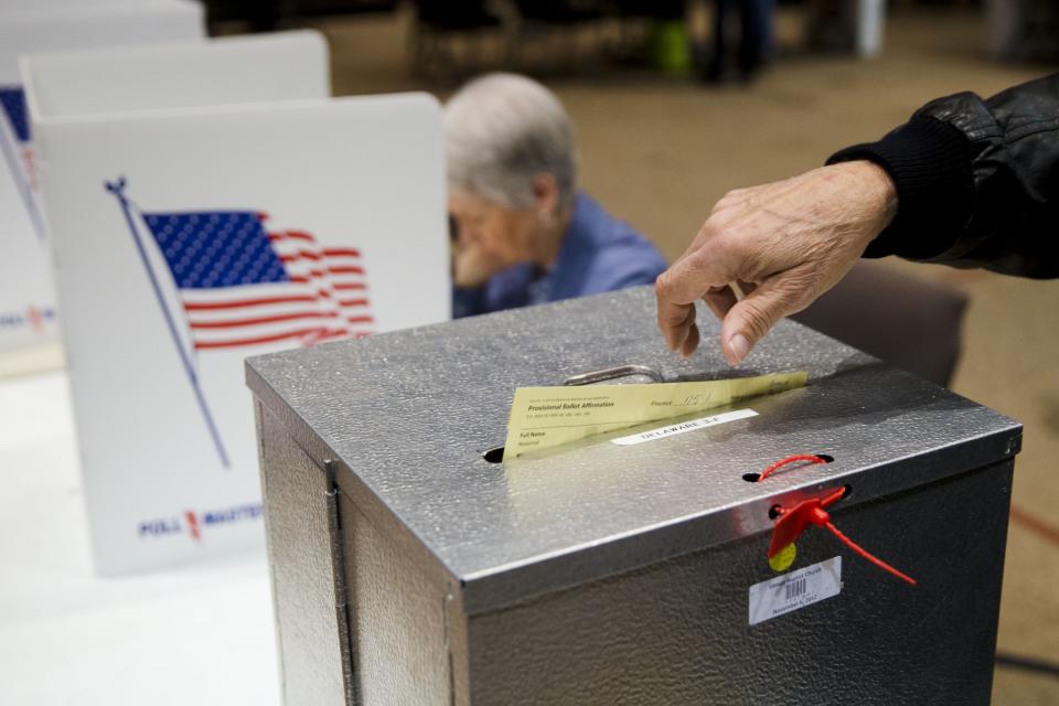 A primary election voter casts a provisional ballot at a polling place in Westerville, Ohio in March 15, 2015. (Photo: Matt Rourke/AP)