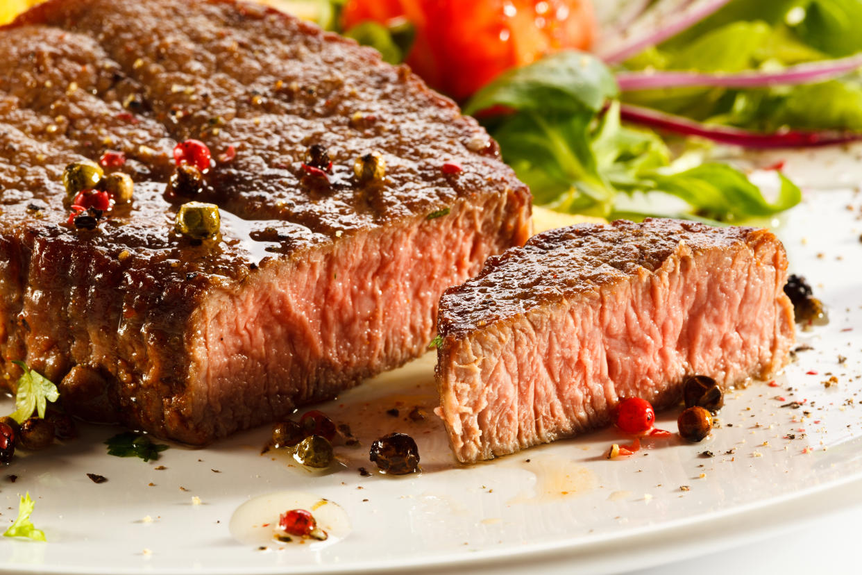 Grilled steak, French fries and vegetables