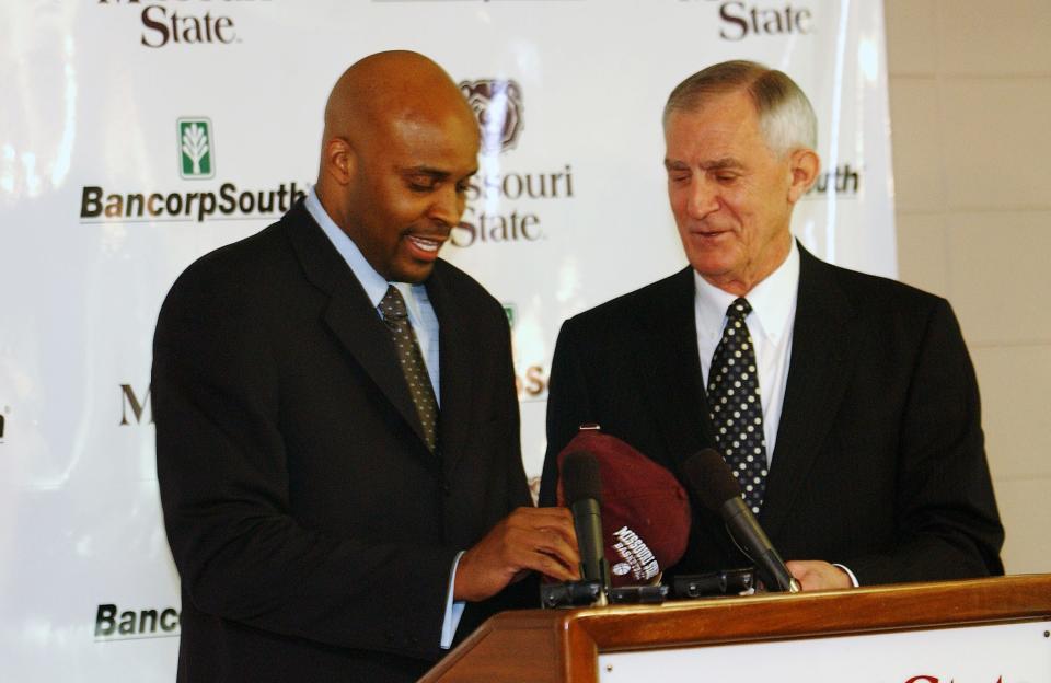 New MSU basketball coach Cuonzo Martin gets a MSU cap from then-MSU athletics director Bill Rowe during a news conference in 2011.