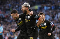 Manchester City's Sergio Aguero, right, celebrates with his teammate Phil Foden after scoring his side's first goal during the League Cup soccer match final between Aston Villa and Manchester City, at Wembley stadium, in London, England, Sunday, March 1, 2020. (AP Photo/Alastair Grant)
