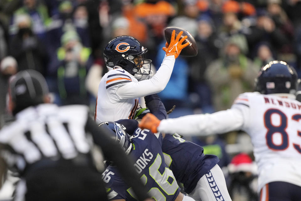 Chicago Bears wide receiver Damiere Byrd, top, leaps to grab a two-point conversion to score against the Seattle Seahawks during the second half of an NFL football game, Sunday, Dec. 26, 2021, in Seattle. (AP Photo/Stephen Brashear)