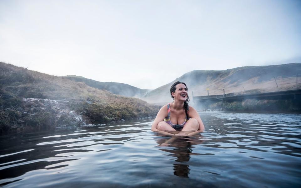 Woman in thermal river - Cavan Images RF