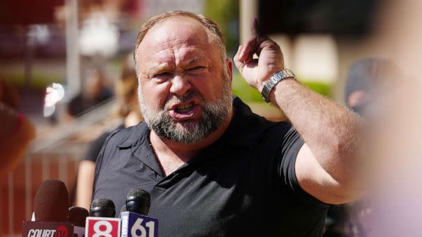 PHOTO: InfoWars founder Alex Jones speaks to the media outside Waterbury Superior Court during his trial on September 21, 2022 in Waterbury, Connecticut. (Joe Buglewicz/Getty Images)