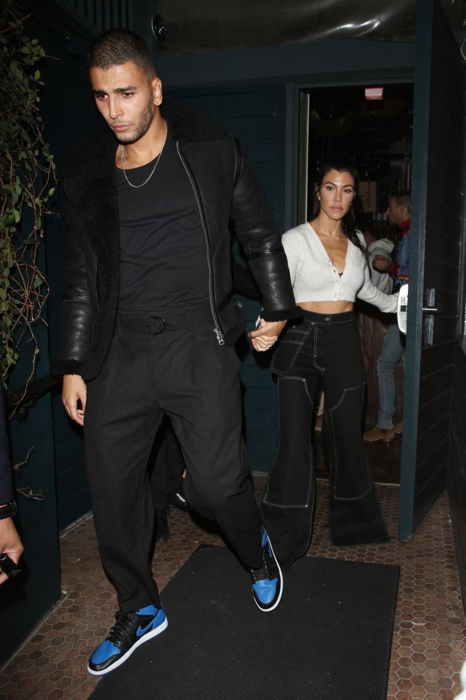 Kourtney Kardashian and Younes Bendjima leave a venue