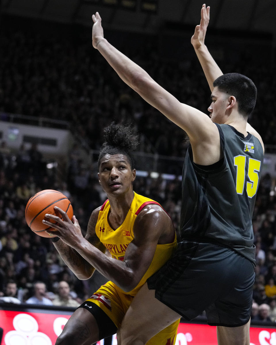 Maryland forward Julian Reese (10) tries to get around Purdue center Zach Edey (15) during the first half of an NCAA college basketball game in West Lafayette, Ind., Sunday, Jan. 22, 2023. (AP Photo/Michael Conroy)