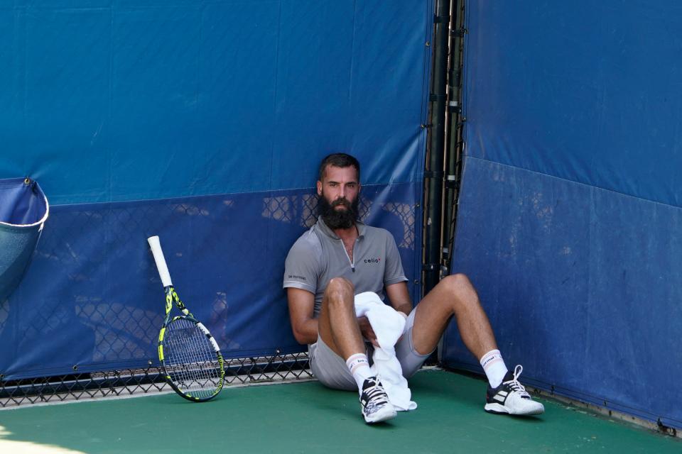 Benoit Paire, pictured here sitting on the court during his match against Cameron Norrie at the US Open.